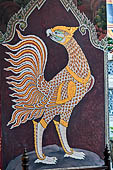 Bangkok Grand Palace, murals of the gallery of the Wat Phra Kaew, Nok Samphati the oldest son of Garuda, it has the face of the Garuda and the body of a bird with a red plumage. 